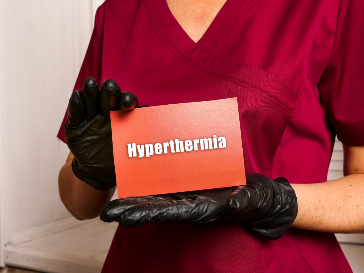 Women holding a card that says Hypothermia