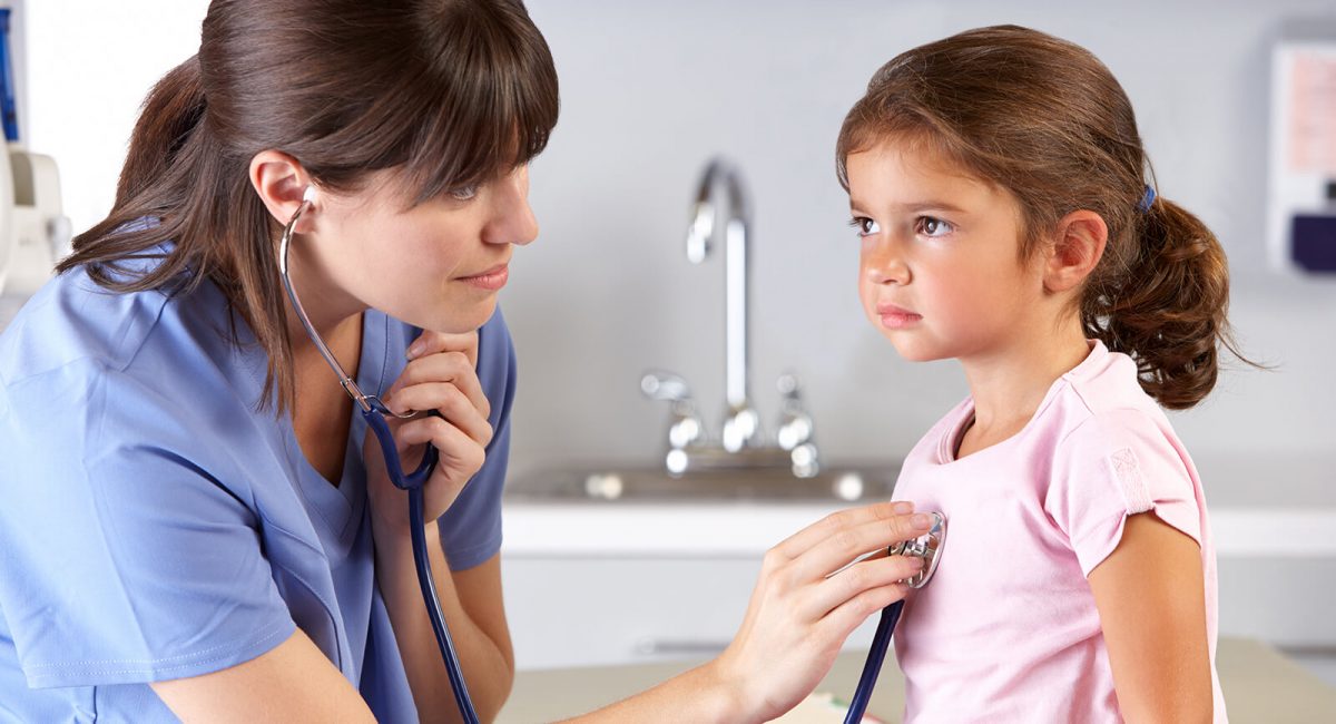 Image of a clinician listening to a pediatric patient’s breathing using a stethoscope